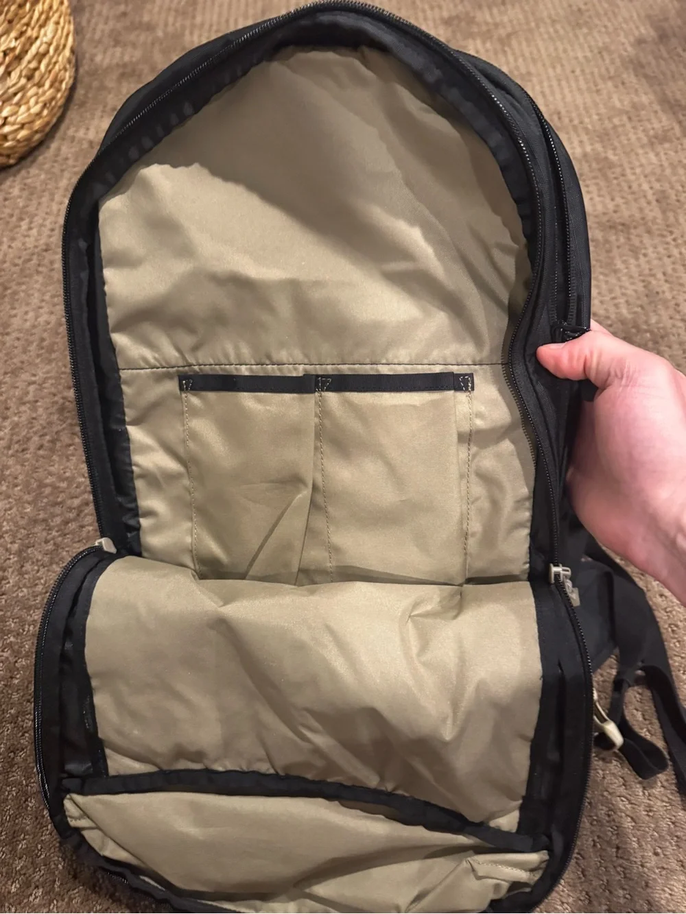 Dakine Black hydration Backpack with Tan Patterned Straps and hip straps